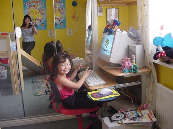 young girl at computer desk